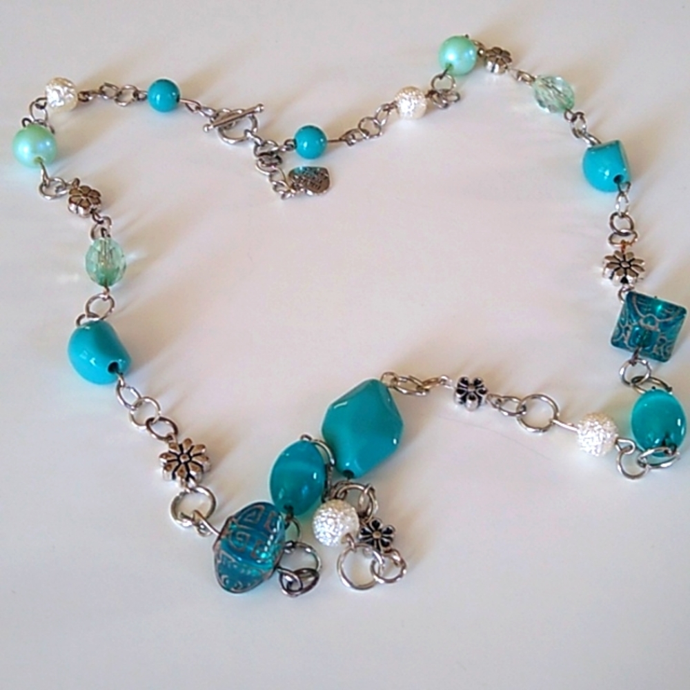 Women's handmade silver metal necklace with turquoise beads